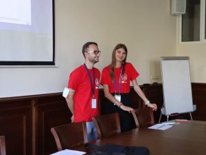 A boy and a girl volunteers doing a presentation